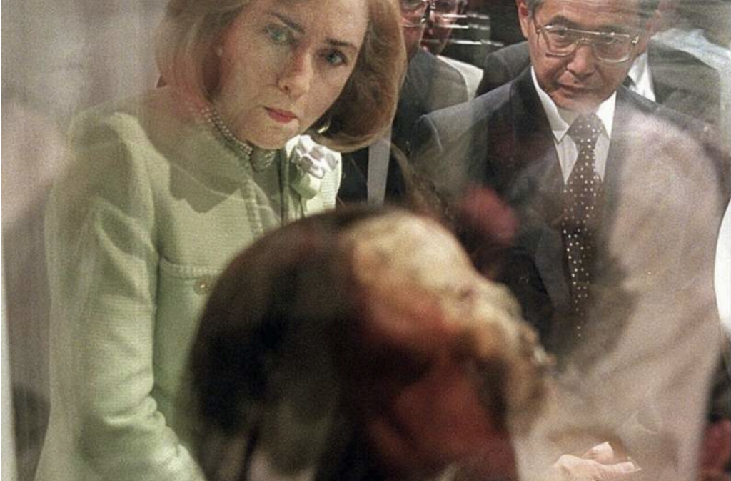 First lady Hillary Rodham Clinton and Peru Prime Minister Alberto Fujimori look over a 500-year-old mummy on display at the National Geographic Society in Washington, Tuesday, May 21, 1996. The Ampato Ice Maiden, discovered near the summit of Mount Ampato in the Peruvian Andes, is the first frozen Inca female mummy and may be the best preserved of any mummy found in the Americas. Credit: AP Photo/Ron Edmonds, File