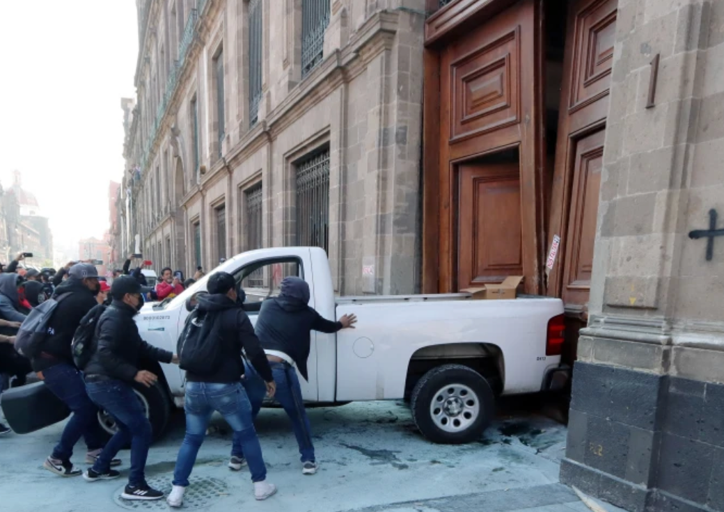 Protesters crash truck through National Palace’s door in Mexico